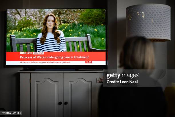 Relative of the Photographer watches television, as Catherine, The Princess of Wales announces that she is receiving a preventative course of...