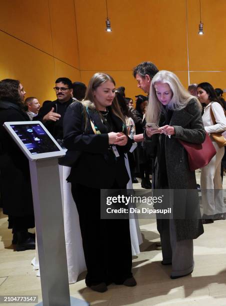 Attendees use the ZERO10 AR Mirror at The BoF Professional Summit at The Times Center on March 22, 2024 in New York City.