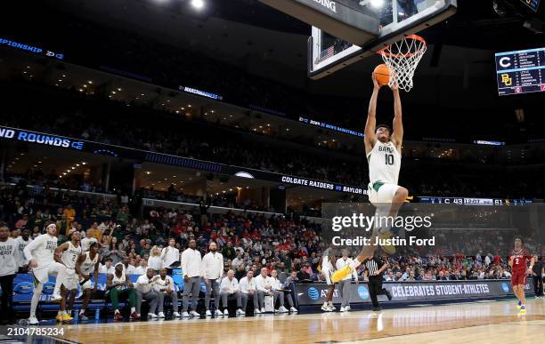 RayJ Dennis of the Baylor Bears dunks in the first round of the NCAA Men's Basketball Tournament against the Colgate Raiders at FedExForum on March...