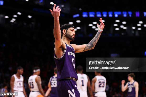 Boo Buie of the Northwestern Wildcats reacts during overtime of the game against the Florida Atlantic Owls during the first round of the NCAA Men’s...