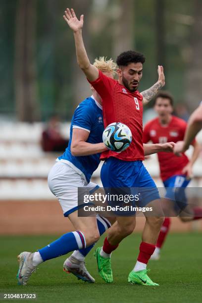 Ferhat Saglam of Liechtenstein and Andrias Edmundsson of Faroe Islands battle for the ball during the International Friendly match between...