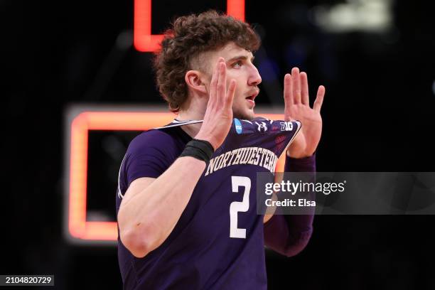 Nick Martinelli of the Northwestern Wildcats reacts after defeating the Florida Atlantic Owls in the first round of the NCAA Men's Basketball...