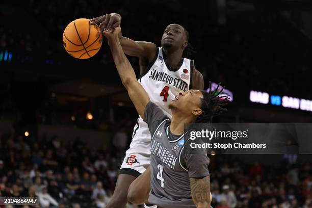 Jay Pal of the San Diego State Aztecs blocks a shot by Eric Gaines of the UAB Blazers during the second half in the first round of the NCAA Men's...