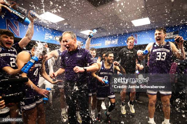 Head coach Chris Collins of the Northwestern Wildcats celebrates in the locker room after defeating the Florida Atlantic Owls during the first round...