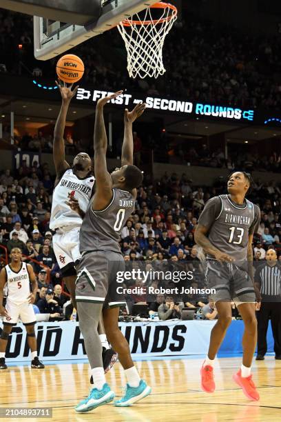 Jay Pal of the San Diego State Aztecs drives to the basket against Javian Davis of the UAB Blazers during the second half in the first round of the...