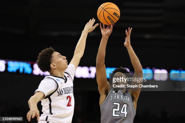Efrem Johnson of the UAB Blazers shoots the ball against Miles Byrd of the San Diego State Aztecs during the second half in the first round of the...