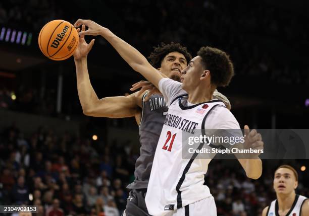 Miles Byrd of the San Diego State Aztecs fouls Yaxel Lendeborg of the UAB Blazers during the second half in the first round of the NCAA Men's...