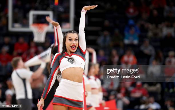 New Mexico Lobos cheerleader performs during a game against the Clemson Tigers in the first round of the NCAA Men's Basketball Tournament at...