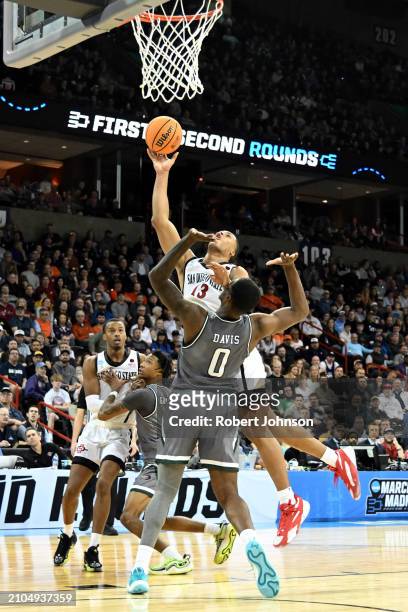 Jaedon LeDee of the San Diego State Aztecs drives to the basket against Javian Davis of the UAB Blazers during the second half in the first round of...