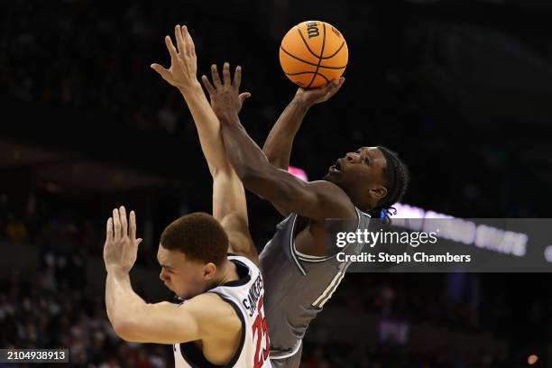 Alejandro Vasquez of the UAB Blazers drives to the basket against Elijah Saunders of the San Diego State Aztecs during the second half in the first...