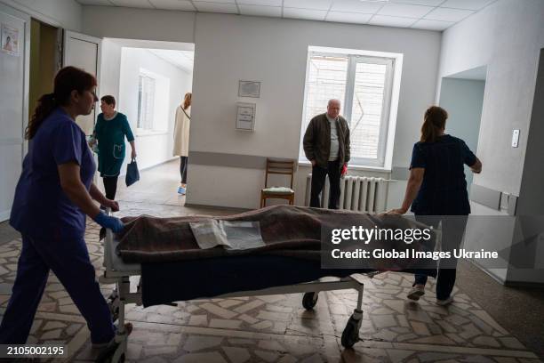 Nurses transport a lying patient through a hospital corridor during a power outage caused by a Russian missile strike on the city's energy sector on...