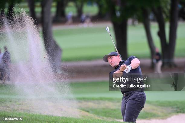 Scott Stallings of the United States plays a shot from a bunker on the 18th hole during the second round of the Valspar Championship at Copperhead...