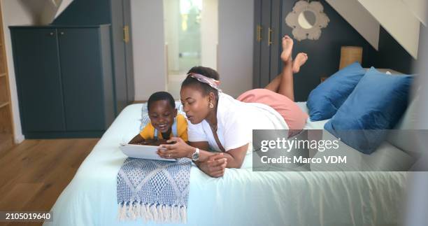 black woman, child and tablet for e learning, online book and education on bed in bedroom, house and home for homework. family, mother and girl with technology for reading, development or knowledge - multimedia learning stock pictures, royalty-free photos & images