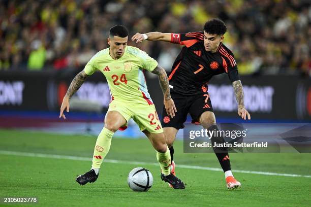 Pedro Porro of Spain is challenged by Luis Diaz of Colombia during the international friendly match between Spain and Colombia at London Stadium on...