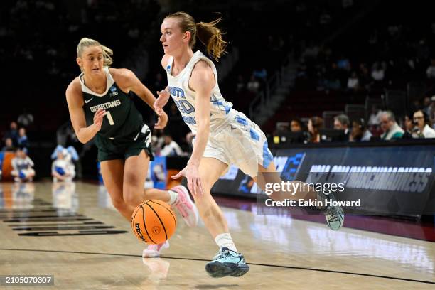 Lexi Donarski of the North Carolina Tar Heels dribbles the ball against Tory Ozment of the Michigan State Spartans in the first quarter during the...