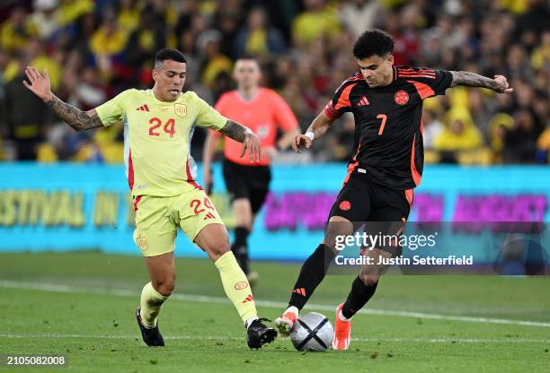 Luis Diaz of Colombia controls the ball under pressure by Pedro Porro of Spain during the international friendly match between Spain and Colombia at...