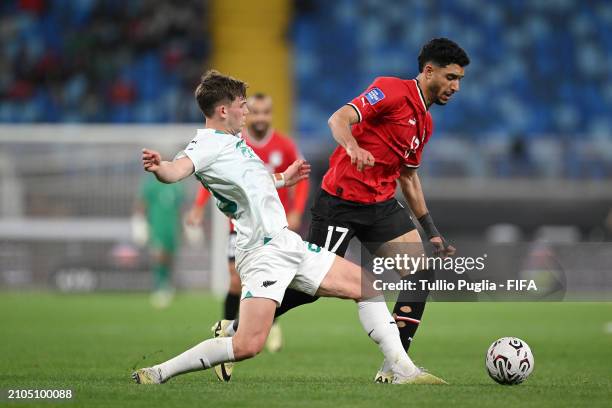 Omar Khaled Mohamed Abdelsalam Marmoush of Egypt is tackled by Callum Mccowatt of New Zealand during the FIFA Series 2024 Egypt match between Egypt...