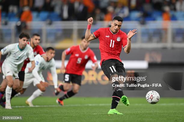 Mostafa Mohamed Ahmed Abdalla of Egypt scores his team's first goal from the penalty spot during the FIFA Series 2024 Egypt match between Egypt and...