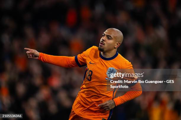 Donyell Malen of the Netherlands celebrates after scoring his team's fourth goal during the friendly match between Netherlands and Scotland at Johan...