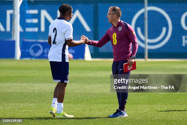 Head coach Tom Curtis of England U18 shakes hands with Triston Rowe after the International Friendly match between England U18 and Germany U18 at...