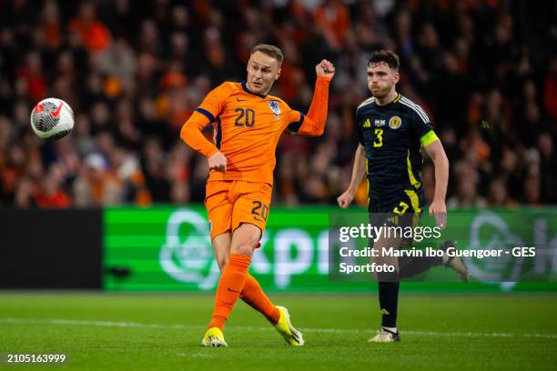 Andrew Robertson of Scotland confronts Teun Koopmeiners of the Netherlands during the friendly match between Netherlands and Scotland at Johan Cruyff...