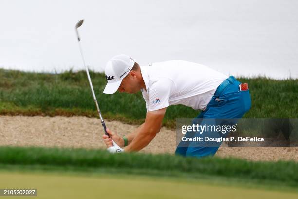 Justin Thomas of the United States reacts after a shot from a bunker on the 18th hole during the second round of the Valspar Championship at...