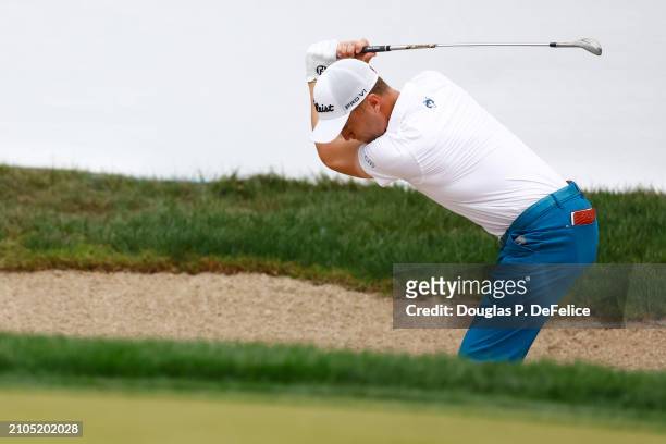 Justin Thomas of the United States reacts after a shot from a bunker on the 18th hole during the second round of the Valspar Championship at...