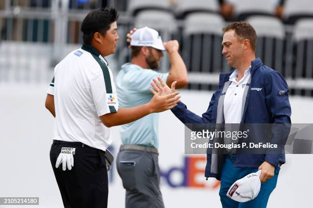 Sungjae Im of South Korea and Justin Thomas of the United States shake hands on the 18th green of the United States during the second round of the...