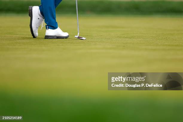 Justin Thomas of the United States shoes and putter are seen on the 18th green during the second round of the Valspar Championship at Copperhead...