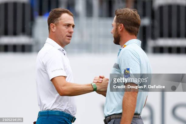 Justin Thomas and Sam Burns of the United States shake hands on the 18th green during the second round of the Valspar Championship at Copperhead...
