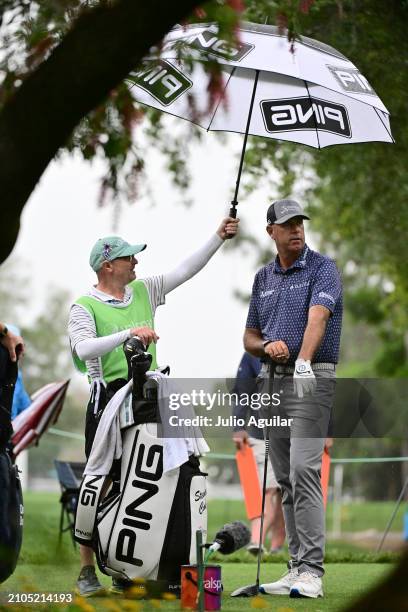 Stewart Cink of the United States looks on with an umbrella from the eighth tee during the second round of the Valspar Championship at Copperhead...