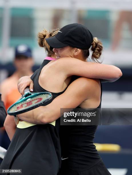 Aryna Sabalenka greets Paula Badosa of Spain at the net after defeating her on day 7 of the Miami Open at Hard Rock Stadium on March 22, 2024 in...