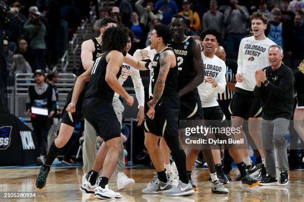 Simpson of the Colorado Buffaloes celebrates with his teammates after hitting the game winning shot to defeat the Florida Gators in the first round...