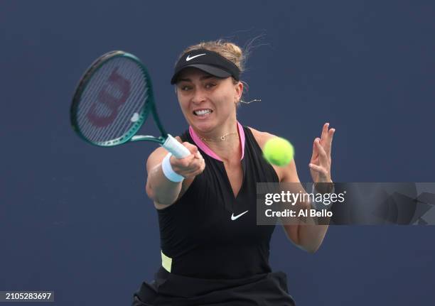 Paula Badosa of Spain returns a shot against Aryna Sabalenka during their match on day 7 of the Miami Open at Hard Rock Stadium on March 22, 2024 in...