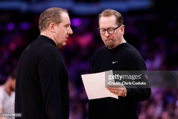 Assistant coach Bryan Gates talks to head coach Nick Nurse of the Philadelphia 76ers during the game against the Phoenix Suns at Footprint Center on...