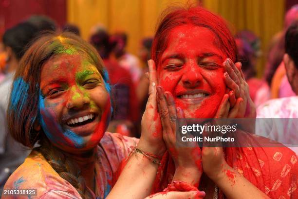 People are playing with colors during Holi celebrations in Nagaon district, Assam, India, on March 25, 2024.