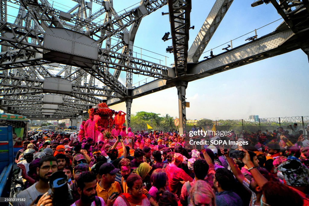 Hindu devotees are seen carrying a Hindu God Satya Narayan...