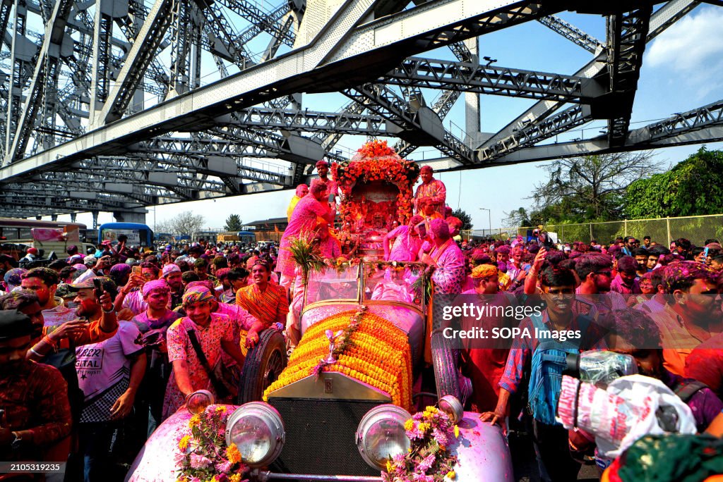 Hindu devotees are seen carrying a Hindu God Satya Narayan...