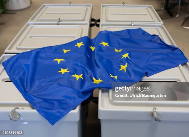 This photo illustration shows a European flag on ballot boxes on March 25, 2024 in Bonn, Germany. The European elections will take place from June...