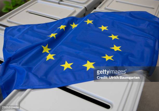 This photo illustration shows a European flag on ballot boxes on March 25, 2024 in Bonn, Germany. The European elections will take place from June...