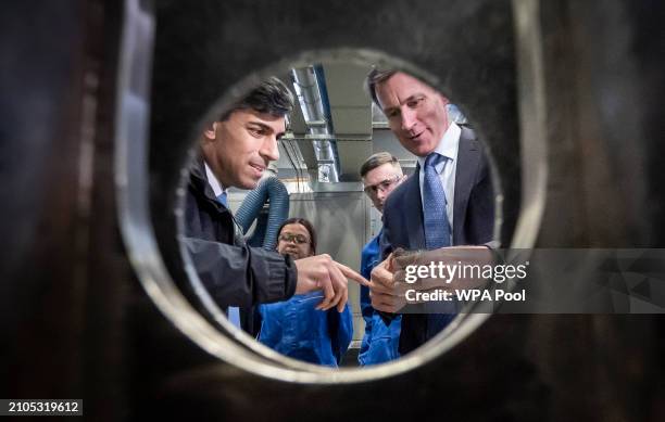 Prime Minister Rishi Sunak and and Britain's Chancellor of the Exchequer Jeremy Hunt during a visit to BAE Systems, Submarines Academy for Skills and...