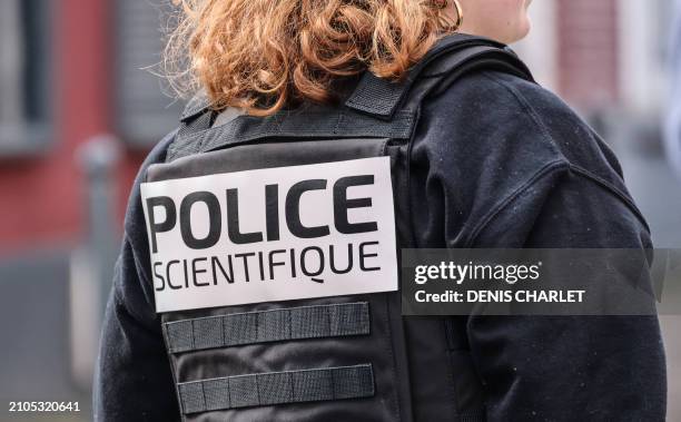 Forensic of the French police, is seen as France's Minister for Interior and Overseas Gerald Darmanin speaks with police officers after an "XXL...