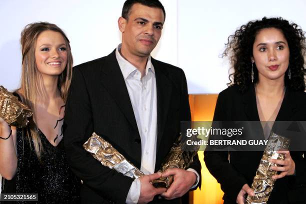 Tunisian born director Abdellatif Kechiche, French actress Sara Forestier and French screenplay writer Ghalya Lacroix pose with their Awards, during...