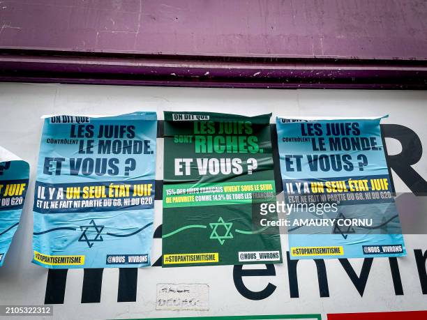 Posters from the "We will survive" collective pasted on a wall on Chaussee d'Antin street in the 9th arrondissement with slogans repeating...