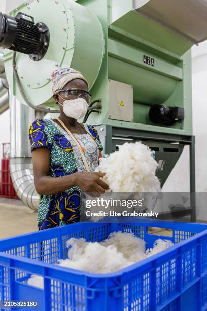 At the Benin Textile Cooperation Fabric, workers process cotton and silk into yarns in a spinning and dyeing mill under GOTS Standard in a production...