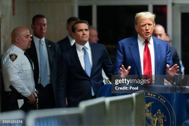 Former U.S. President Donald Trump makes comments as he leaves court after a pre-trial hearing in a hash money case in criminal court on March 25,...