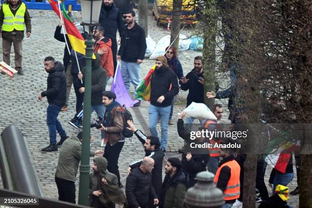 Supporters of the PKK , confront the police during a protest near the European Parliament on March 25, 2024 in Brussels, Belgium.