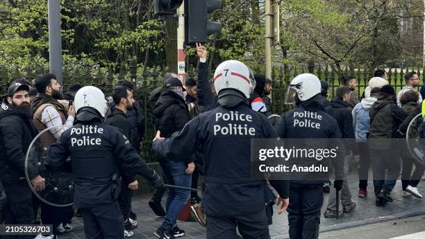 Supporters of the PKK , confront the police during a protest near the European Parliament on March 25, 2024 in Brussels, Belgium.