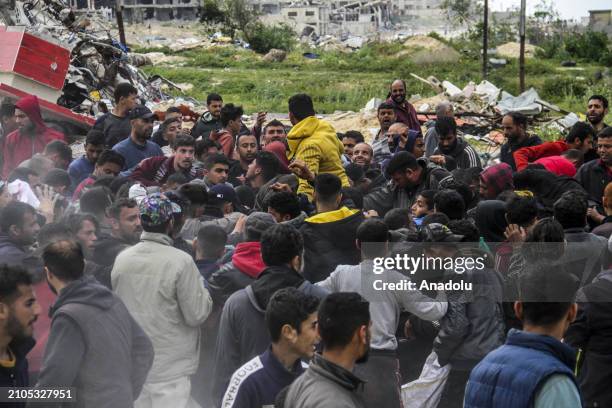 Palestinians rush to coast after humanitarian aids dropped from the air to Sudaniye region amid Israeli attacks in Gaza City, Gaza on March 25, 2024.