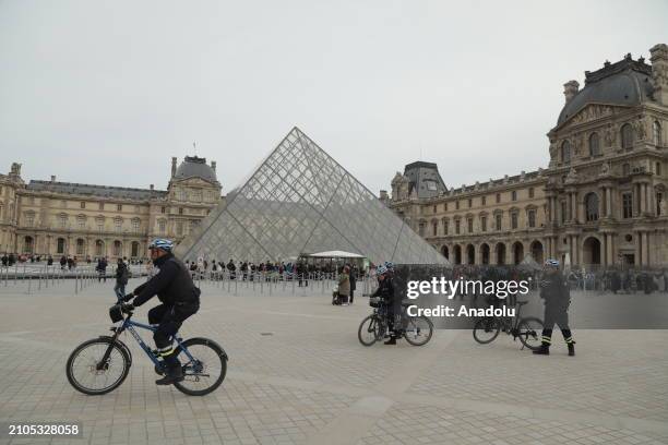 French police takes security measures near louvre pyramid as France raises alert to maximum after the terrorist attack in the Moscow concert hall...